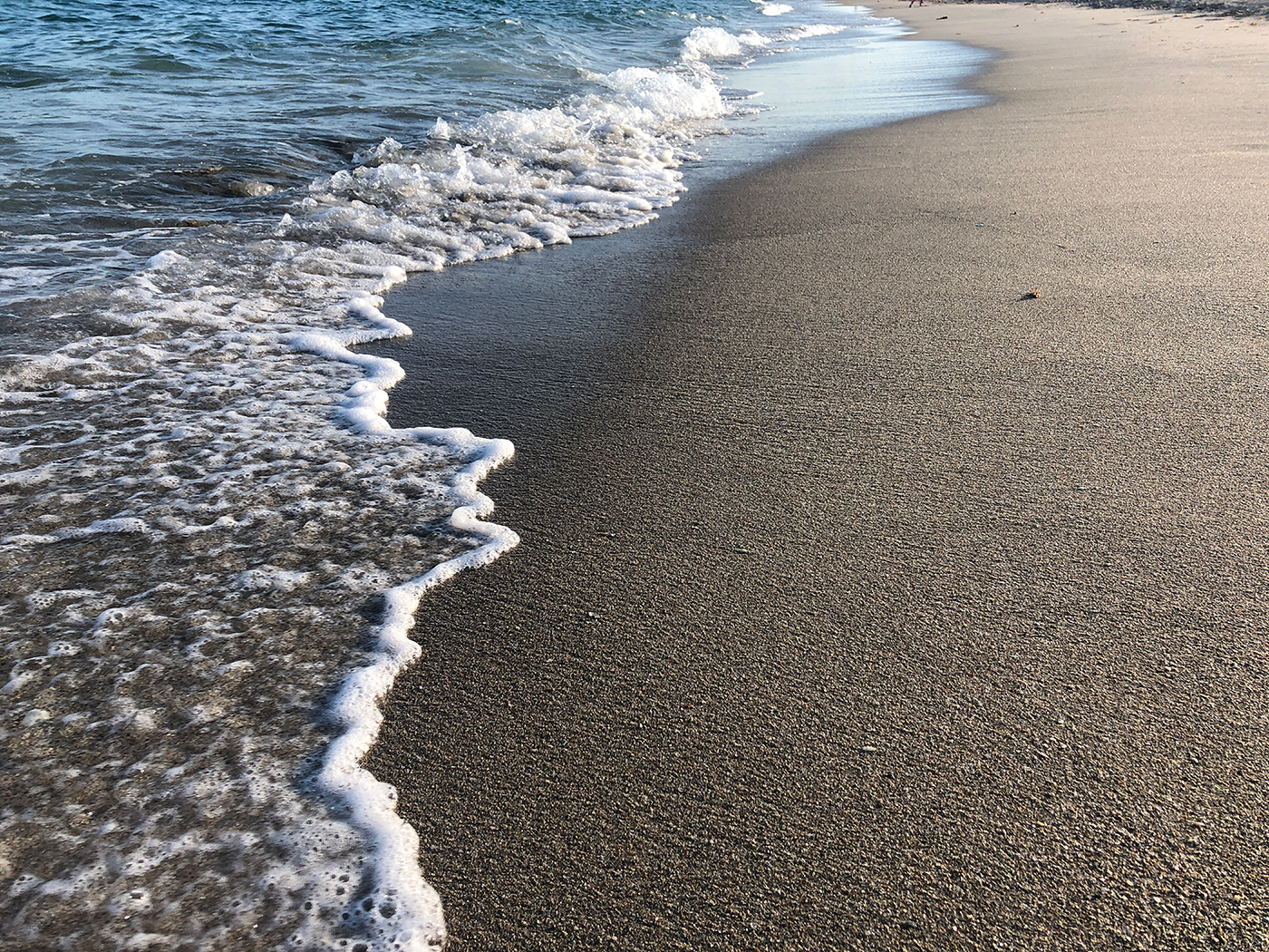 Waves meet sand
